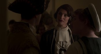 Movie still from “Vita & Virginia” (2018), directed by Chanya Button – A woman wearing a white blouse and a black jacket; Close Up shot, Over the shoulder angle