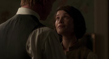 Movie still from “Vita & Virginia” (2018), directed by Chanya Button – A man and a woman looking at one another; Close Up shot, Over the shoulder angle