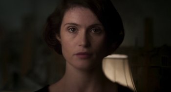 Movie still from “Vita & Virginia” (2018), directed by Chanya Button – A person wearing a black shirt; Close Up shot, High angle
