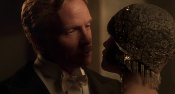 Movie still from “Vita & Virginia” (2018), directed by Chanya Button – A man and a woman are looking at one another; Close Up shot, Low angle