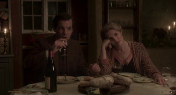 Movie still from “Vita & Virginia” (2018), directed by Chanya Button – A man and a woman sitting at a dinner table; Medium shot, High angle