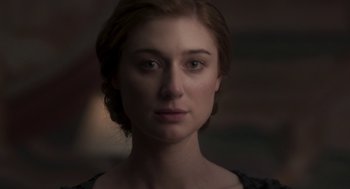 Movie still from “Vita & Virginia” (2018), directed by Chanya Button – A person wearing a black shirt; Close Up shot, Low angle