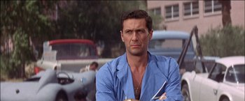 Movie still from “Viva Las Vegas” (1964), directed by George Sidney – A person wearing a blue shirt; Close Up shot, Low angle