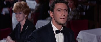 Movie still from “Viva Las Vegas” (1964), directed by George Sidney – A person wearing a suit and a bow tie; Close Up shot, Low angle