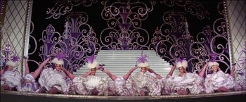 Movie still from “Viva Las Vegas” (1964), directed by George Sidney – A group of women dressed up in fancy outfits; Wide shot, Low angle