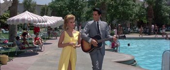 Movie still from “Viva Las Vegas” (1964), directed by George Sidney – A man and a woman are playing a guitar; Medium shot, Low angle