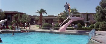 Movie still from “Viva Las Vegas” (1964), directed by George Sidney – A man and a woman standing at the top of a pool slide; Extreme Wide shot, High angle