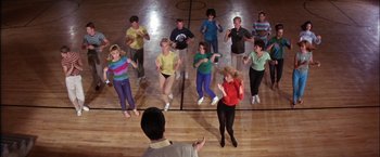 Movie still from “Viva Las Vegas” (1964), directed by George Sidney – A group of people standing in a gymnasium; Wide shot, Overhead angle
