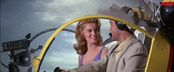Movie still from “Viva Las Vegas” (1964), directed by George Sidney – A man and a woman are in a helicopter cockpit; Medium shot, Low angle