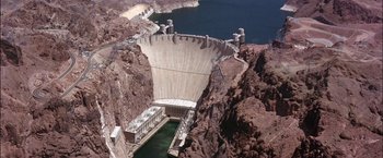 Movie still from “Viva Las Vegas” (1964), directed by George Sidney – A view of a dam from a helicopter; Extreme Wide shot, High angle