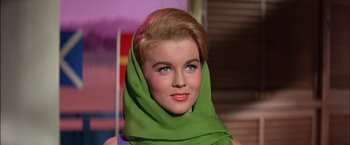 Movie still from “Viva Las Vegas” (1964), directed by George Sidney – A person wearing a green head scarf; Close Up shot, Low angle