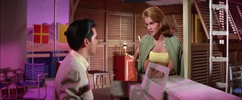 Movie still from “Viva Las Vegas” (1964), directed by George Sidney – A man and a woman talking to each other; Medium shot, Low angle