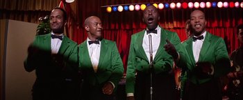 Movie still from “Viva Las Vegas” (1964), directed by George Sidney – A couple of men in green jackets singing; Medium shot, Low angle