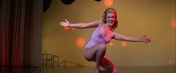 Movie still from “Viva Las Vegas” (1964), directed by George Sidney – A woman in a leotard is on a stage; Medium shot, Low angle