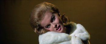 Movie still from “Viva Las Vegas” (1964), directed by George Sidney – A woman in a white fur coat with her head tilted to the side; Close Up shot, Low angle