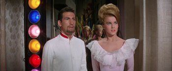 Movie still from “Viva Las Vegas” (1964), directed by George Sidney – A man and a woman standing next to each other; Medium shot, Low angle