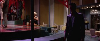 Movie still from “Viva Las Vegas” (1964), directed by George Sidney – A man and a woman are sitting in a room; Wide shot, Over the shoulder angle