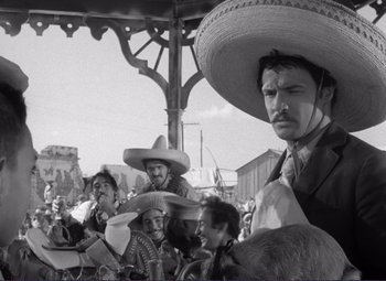 Movie still from “Viva Zapata!” (1952), directed by Elia Kazan – A group of people wearing sombreros in a crowd; Medium shot, Low angle