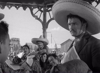 Movie still from “Viva Zapata!” (1952), directed by Elia Kazan – A group of men and women wearing sombreros; Medium shot, Low angle