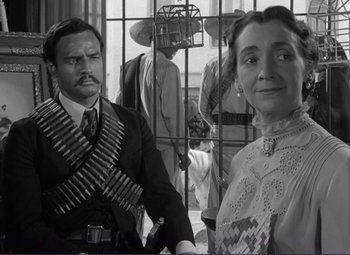 Movie still from “Viva Zapata!” (1952), directed by Elia Kazan – A man and a woman standing next to each other; Medium shot, Low angle
