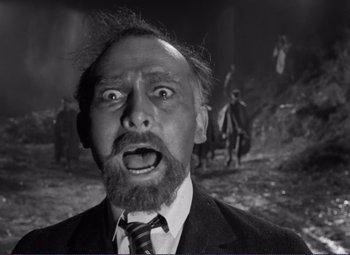 Movie still from “Viva Zapata!” (1952), directed by Elia Kazan – An old photo of a man in a suit and tie; Close Up shot, Low angle