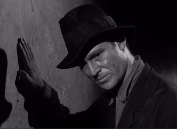 Movie still from “Viva Zapata!” (1952), directed by Elia Kazan – A black and white photo of a man wearing a hat; Close Up shot, Low angle