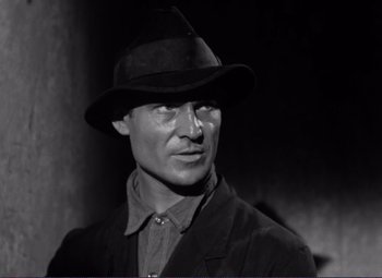 Movie still from “Viva Zapata!” (1952), directed by Elia Kazan – A black and white photo of a man wearing a hat; Close Up shot, Low angle