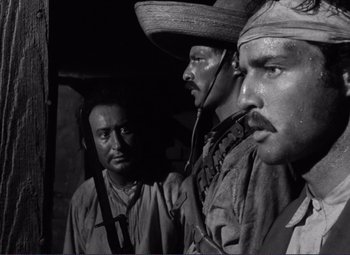 Movie still from “Viva Zapata!” (1952), directed by Elia Kazan – A group of men standing next to each other; Close Up shot, Low angle
