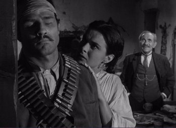 Movie still from “Viva Zapata!” (1952), directed by Elia Kazan – A man and a woman in a black and white photo; Medium shot, Low angle