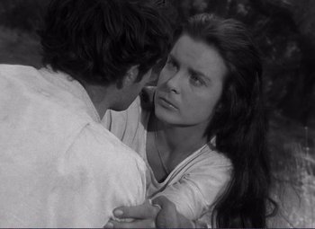 Movie still from “Viva Zapata!” (1952), directed by Elia Kazan – A man and a woman embracing each other in a forest; Close Up shot, Over the shoulder angle