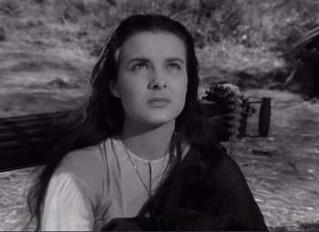 Movie still from “Viva Zapata!” (1952), directed by Elia Kazan – Black and white photograph of a young woman with long black hair; Close Up shot, High angle