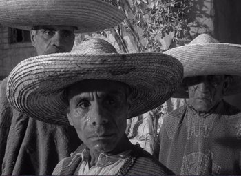 Movie still from “Viva Zapata!” (1952), directed by Elia Kazan – A group of men wearing sombreros in front of a tree; Close Up shot, Low angle