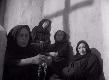 Movie still from “Viva Zapata!” (1952), directed by Elia Kazan – A black and white photo of a group of nuns; Medium shot, High angle