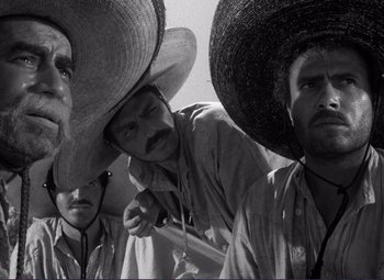 Movie still from “Viva Zapata!” (1952), directed by Elia Kazan – A group of men wearing sombreros standing next to each other; Close Up shot, Low angle