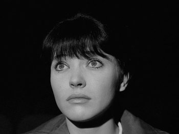 Movie still from “My Life to Live” (1962), directed by Jean-Luc Godard – Black and white photograph of a woman looking up; Close Up shot, High angle