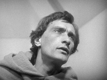 Movie still from “My Life to Live” (1962), directed by Jean-Luc Godard – Black and white photograph of a man looking up; Close Up shot, High angle