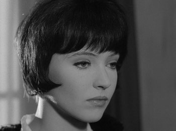 Movie still from “My Life to Live” (1962), directed by Jean-Luc Godard – A black and white photo of a woman's face; Close Up shot, High angle