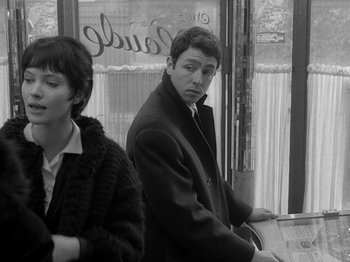 Movie still from “My Life to Live” (1962), directed by Jean-Luc Godard – A black and white photo of a man and a woman; Medium shot, Over the shoulder angle