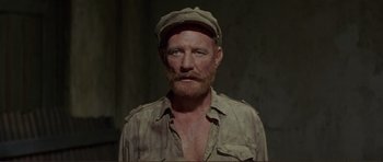 Movie still from “Von Ryan's Express” (1965), directed by Mark Robson – A person wearing a hat; Close Up shot, High angle