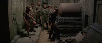 Movie still from “Von Ryan's Express” (1965), directed by Mark Robson – A group of men standing next to each other; Wide shot, High angle