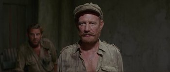 Movie still from “Von Ryan's Express” (1965), directed by Mark Robson – A person wearing a hat; Close Up shot, Low angle