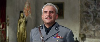 Movie still from “Von Ryan's Express” (1965), directed by Mark Robson – An older man in a uniform with a mustache; Close Up shot, Low angle
