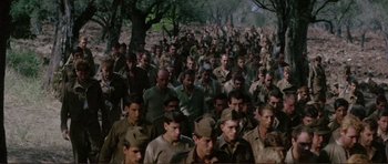 Movie still from “Von Ryan's Express” (1965), directed by Mark Robson – A large group of men in military fatigues; Extreme Wide shot, High angle