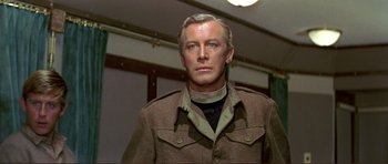 Movie still from “Von Ryan's Express” (1965), directed by Mark Robson – A person wearing a jacket; Close Up shot, Low angle