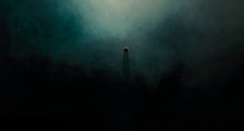 Movie still from “Voyage of Time” (2016), directed by Terrence Malick – A lighthouse in the middle of the night; Extreme Wide shot, Low angle