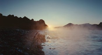 Movie still from “Voyage of Time” (2016), directed by Terrence Malick – A body of water near a rocky shore; Extreme Wide shot, Low angle