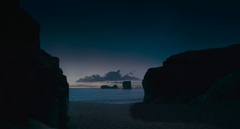 Movie still from “Voyage of Time” (2016), directed by Terrence Malick – A view of the ocean at night from the beach; Extreme Wide shot, Low angle