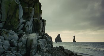 Movie still from “Voyage of Time” (2016), directed by Terrence Malick – A view of the ocean from a rocky shore; Extreme Wide shot, Low angle