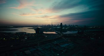Movie still from “Voyage of Time” (2016), directed by Terrence Malick – An aerial view of a city at night; Extreme Wide shot, High angle