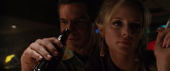 Movie still from “W.” (2008), directed by Oliver Stone – A man and a woman sitting next to each other; Close Up shot, Over the shoulder angle